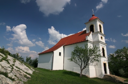 Beautiful little church with nice cloudsの写真素材
