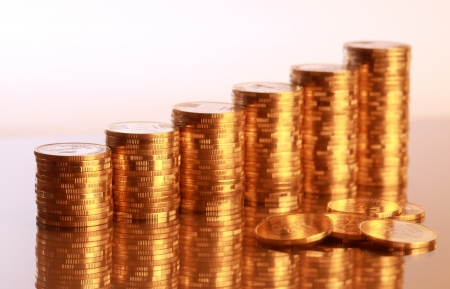 Six coin piles with reflectionの写真素材