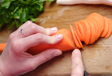 Housewife prepare healthy vegatable carrot to cookingの写真素材