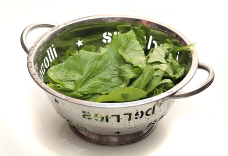 Lettuce leaves in bowl isolated on white background