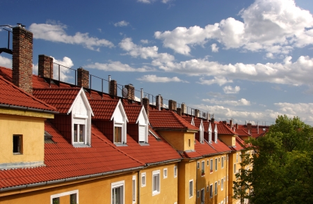 Yellow block house with red roof and nice sky