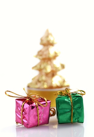 Christmas arrangement, two small red present boxes with candleの写真素材
