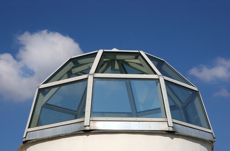 Dome from glass with blue sky and cloudsの写真素材