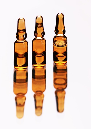 Three medical ampule reflection, isolatedの写真素材