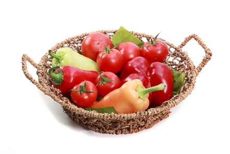 Basket full pf riped vegetables pepper, and tomatoの写真素材