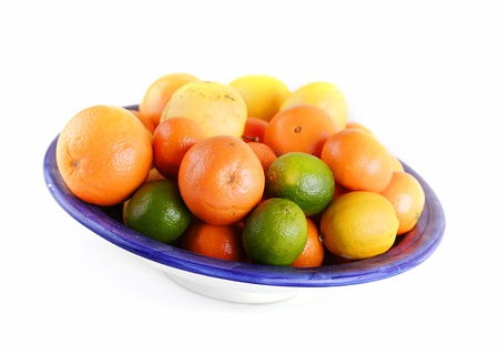 Bowl full of fresh mixed fruit isolated on a white background  の写真素材