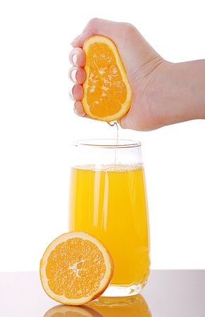 Fresh squeezed orange juice isolated on whiteの写真素材