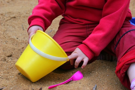 Child plays with sandの写真素材