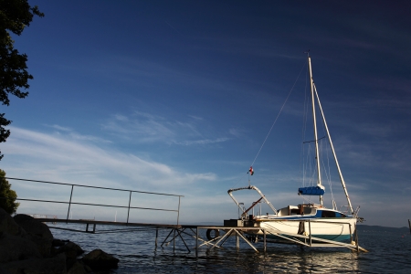 Sailboat on landing-stage at Lake Balaton in summerの写真素材