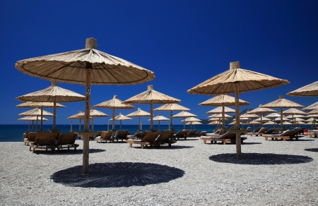Nice vacation picture with beach parasolsの写真素材