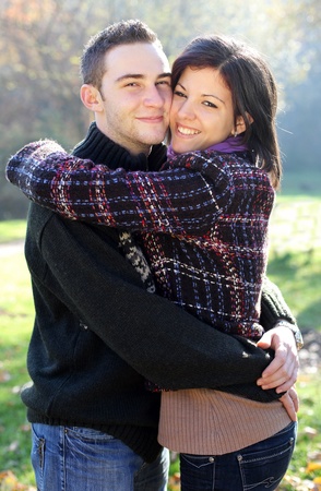 Portrait of romantic young couple in autumn outdoorの写真素材
