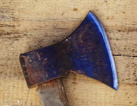 Old axe on wooden backgroundの写真素材