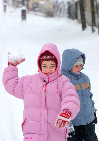Girl with snowballの写真素材