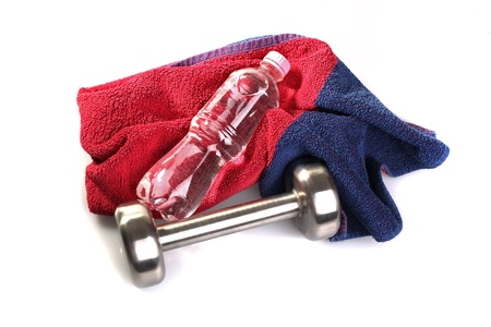 Dumbbell, towel and bottle of waterの写真素材