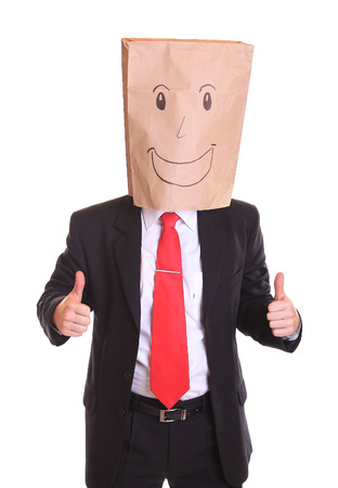 Businessman with a paper bag with smile on headの写真素材