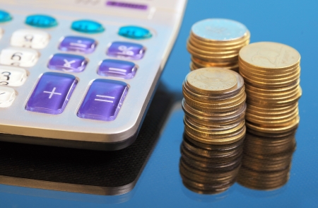 Detail of calculator with coinsの写真素材
