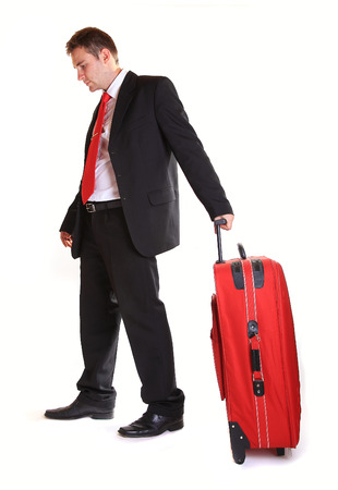 Businessman with suitcase against white backgroundの写真素材