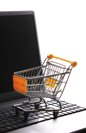 Online shopping e-commerce shopping cart with notebookの写真素材