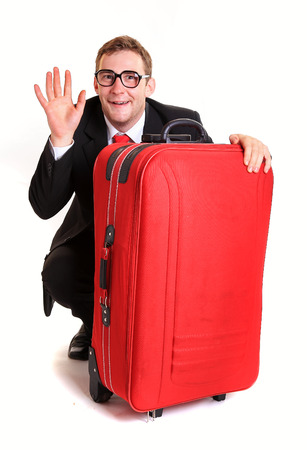 Funny business man hide behind red luggageの写真素材
