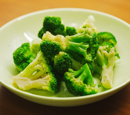 Boiled green broccoli in plateの写真素材