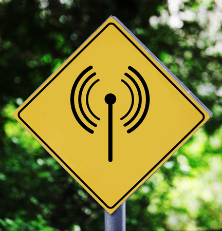 Yellow road signoutdoor with wifi pictogramの写真素材