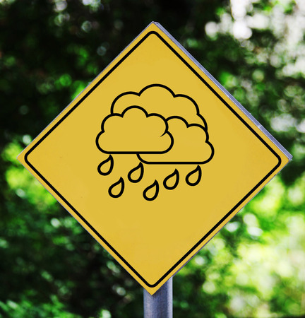 Yellow traffic label with raining weather pictogramの写真素材