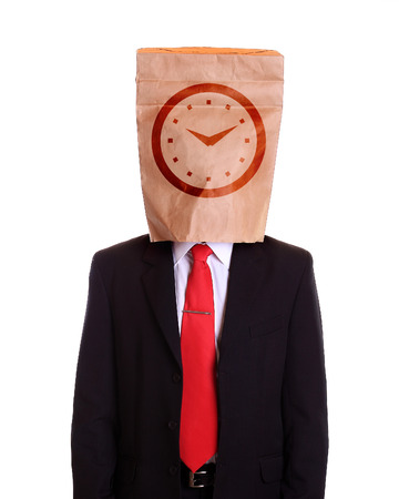 Man with a paper bag on head clock dial on itの写真素材