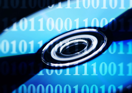 Dvd disc in blue and black with binary numbersの写真素材