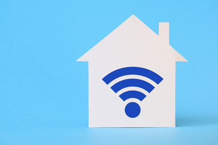 Paper house with wireless network symbolの写真素材