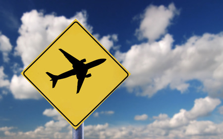 Blue sky clouds and airplane symbolの写真素材