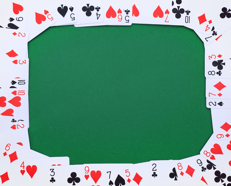 Frame made of french cards on green