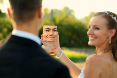 Young couple with outdoor mirrorの写真素材