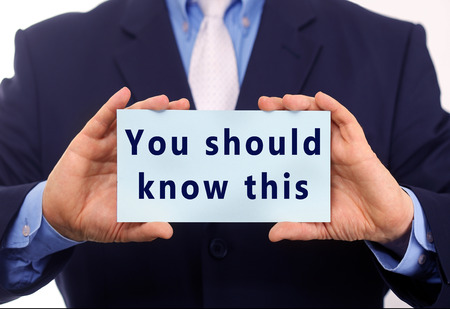 Business man hold paper You Should Know this text on itの写真素材