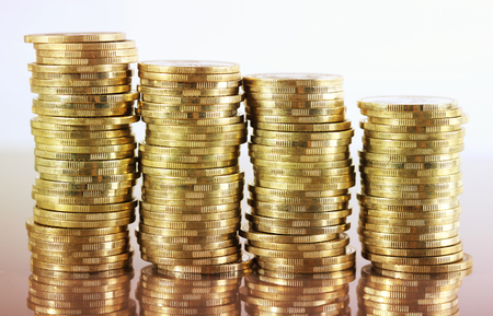 Four coin piles with reflection