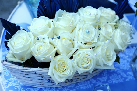 Bunch of white rose in basketの写真素材