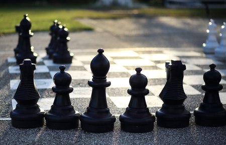 Huge outdoor chess figures on floorの写真素材