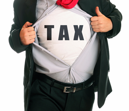 Young angry businessman tearing his shirt - tax body on itの写真素材