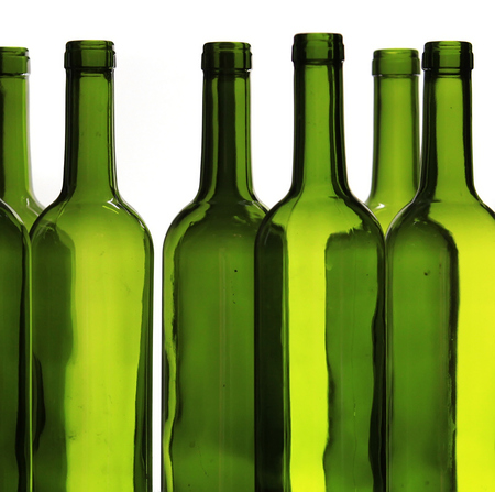 Green wine bottles against whiteの写真素材