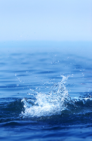 Water splash in blue colorの写真素材