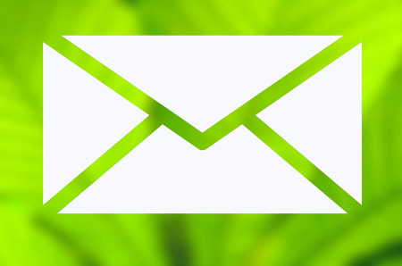 Envelope with green nature backgroundの写真素材