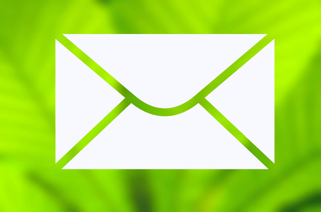 Envelope with green nature backgroundの写真素材