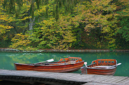 Beautiful lake in forest with boat in national park Plitvice, Croatiaの写真素材