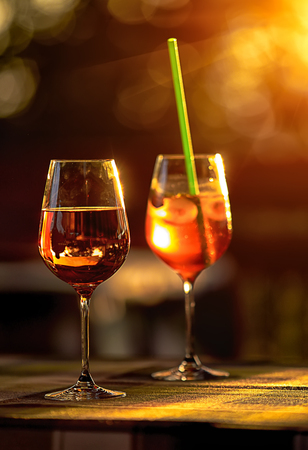 Two glasses with wine and cocktail outdoorの写真素材