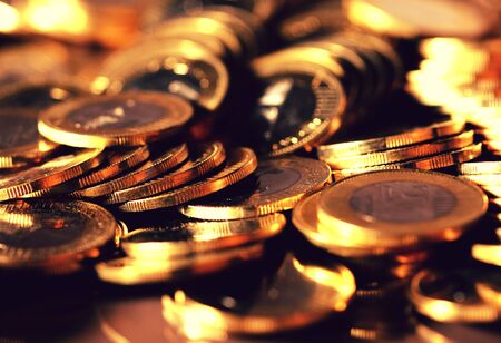 Four coin piles with reflectionの写真素材