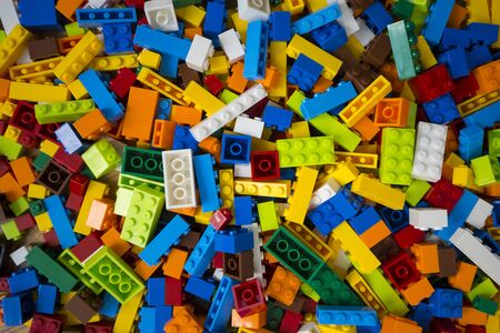 Close-up of a cluttered pile of colorful toy construction bricksの写真素材