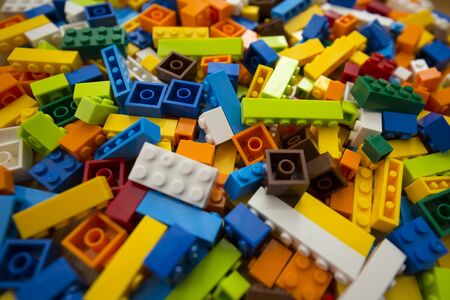 Close-up of a cluttered pile of colorful toy construction bricksの写真素材