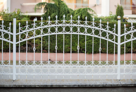 White forged decorative iron fenceの写真素材