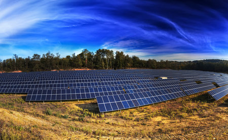 Panorama landscape with photovoltaic solar panel farmの写真素材