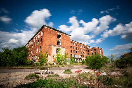 Abandoned brick building at blue skyの写真素材