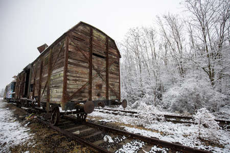 Abandoned vintage train wagon on railway in winter